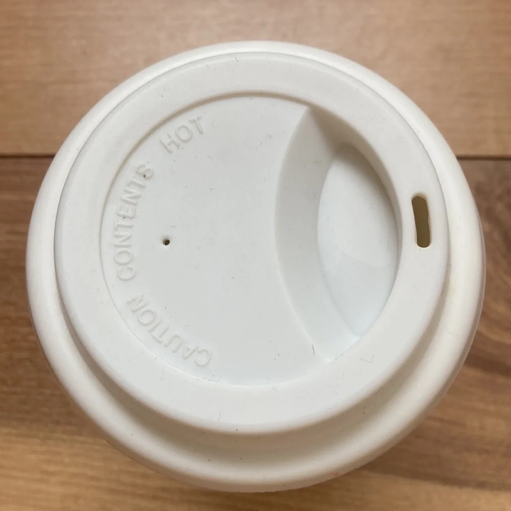 Lancôme ceramic 12 ounce tumbler.